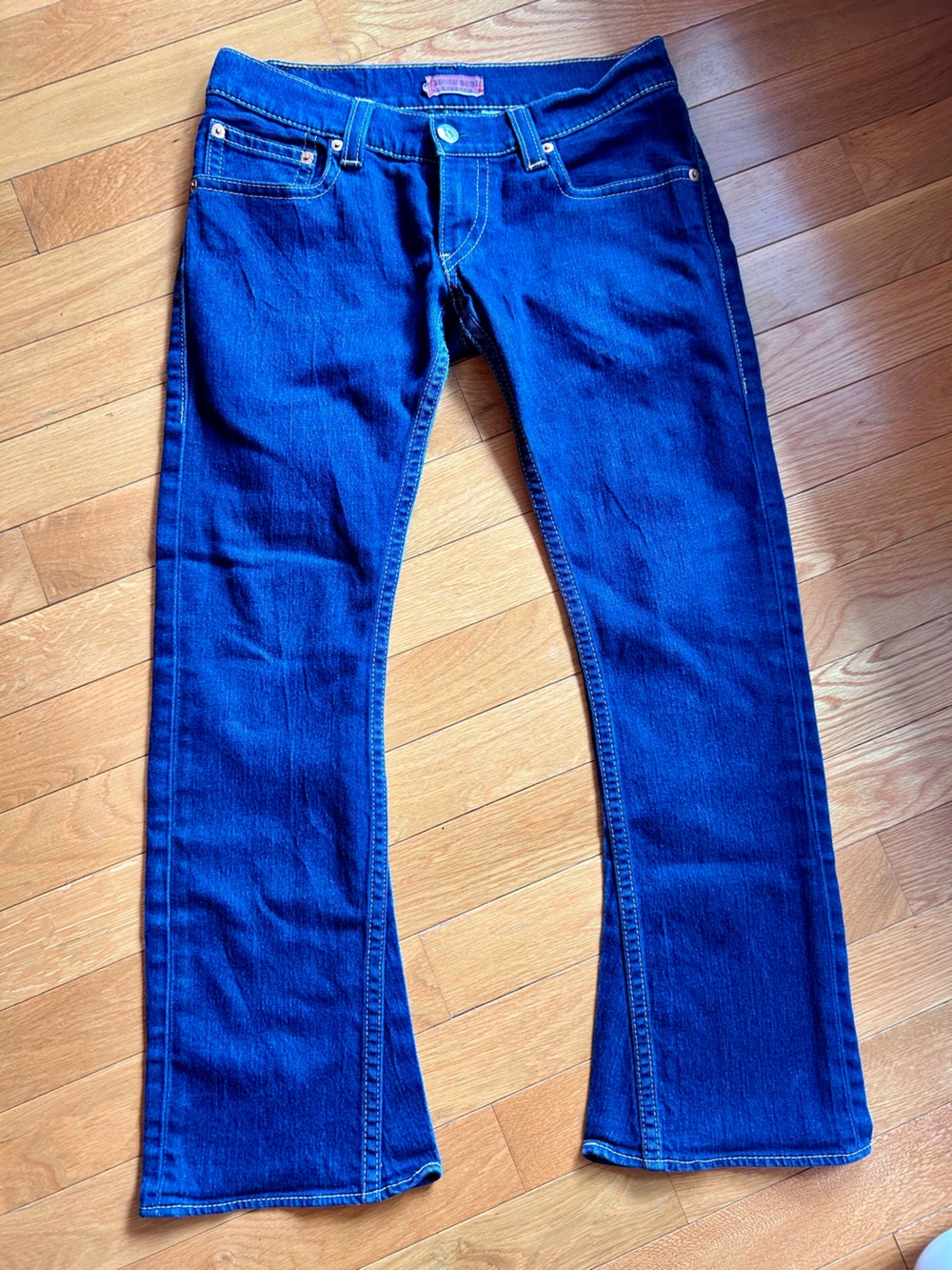Levi’s low rise boot cut jeans in medium blue wash